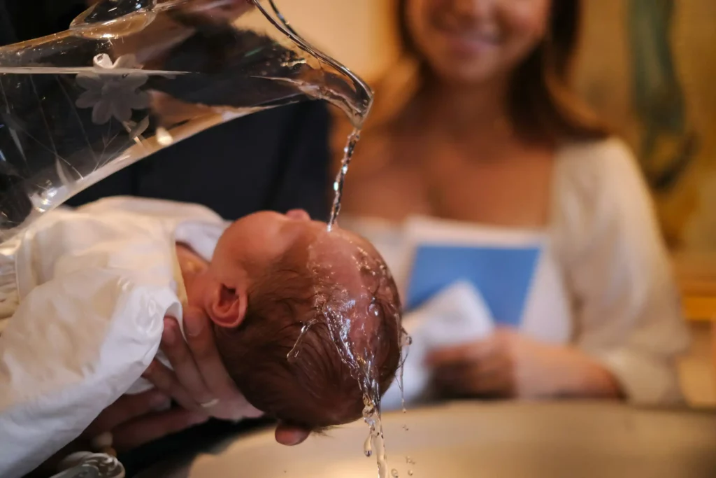a-baby-being-washed-in-a-kitchen-sink